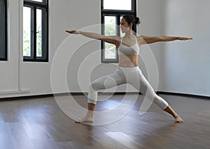 Asian chinese single woman in white practising Yoga
