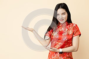 Asian Chinese teen girl hand show display presentation sale promotion posture dressing Qipao traditional cloth