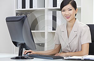 Asian Chinese Woman & Computer in Office
