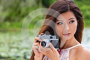 Asian Chinese Woman Girl Taking Photographs With Retro Style Camera