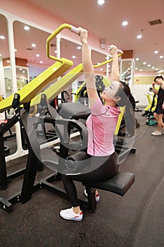 Asian chinese woman in gym ï¼ŒFitness sport woman Training strength in the gym