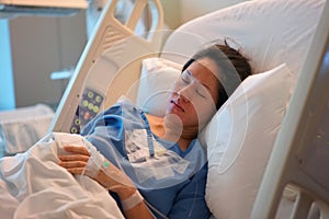 Asian Chinese Woman patient lying in the hospital bed calm and peaceful