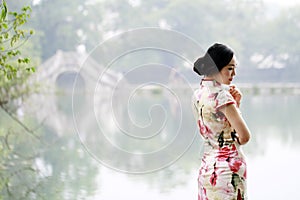 Asian Chinese woman in traditional cheongsam