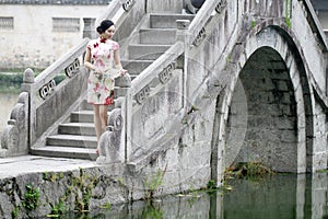 Asian Chinese woman in traditional cheongsam photo