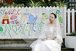 Asian Chinese woman in wedding dress