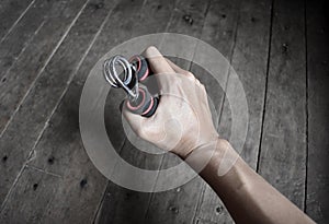 Asian, Chinese young manâ€™s right hand gripping hand exercise gripper