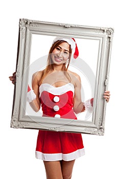 Asian Christmas girl with Santa Claus clothes and frame