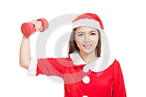 Asian Christmas girl with Santa Claus clothes and red dumbbell