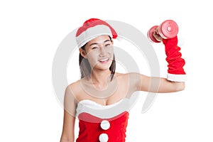 Asian Christmas girl with Santa Claus clothes and red dumbbell.