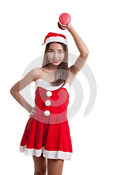 Asian Christmas girl with Santa Claus clothes and red dumbbell.