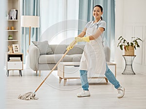 Asian cleaner woman mopping and cleaning dirt and dust in lounge or living room floor in house or home. Happy Japanese