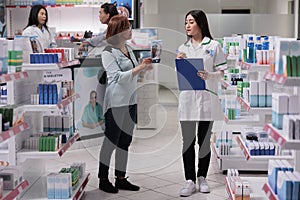 Asian client asking pharmacist for help