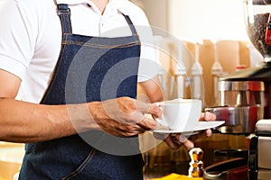 Asian Coffeeshop - barista presents coffee photo