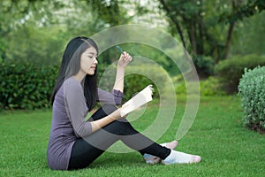 Asian college student on campus in park