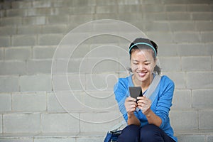 Asian college student using smartphone