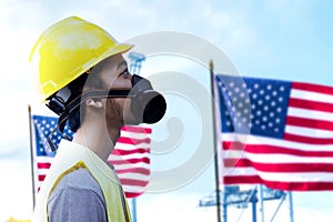 Asian construction worker with hardhat and safety mask standing