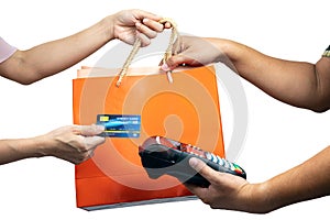 Asian Consumer Making a Purchase with Credit Card and grap Shopping Bag