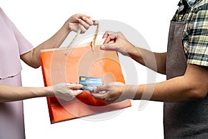 Asian Consumer Making a Purchase with Credit Card and grap Shopping Bag photo