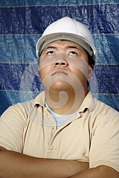 Asian contractor looking up