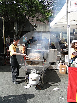 Asian cooks serving food at concessions