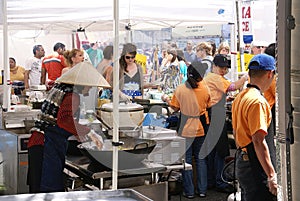 Asian cooks serving food