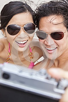 Asian Couple at Beach Taking Selfie Photograph