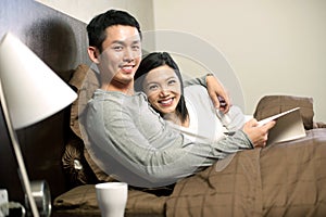 Asian couple in bed