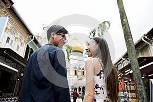 Asian couple dating smiling at each other