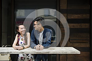 Asian couple dating smiling at each other