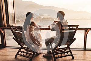 Asian couple drinking Tea Sunrise at Lee wine Rak Thai, Chinese settlement, Mae Hong Son, Thailand