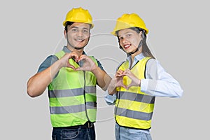 Asian Couple Engineer and Architect giving gestures and expressions on construction field