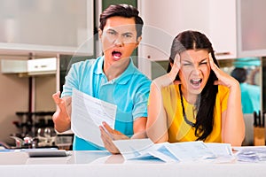 Asian couple fighting unpaid bills