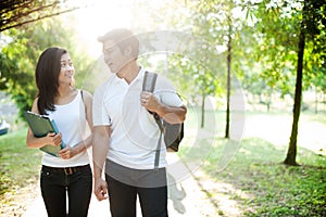 Asian couple going to school