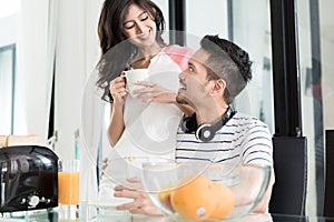 Asian couple having breakfast with toast and coffee