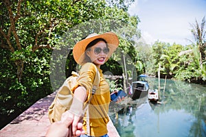 Asian couple holding hands, traveling nature. Travel relax. at tha pom-klong-song-nam. Krabi, in Thailand. Travel Thailand.
