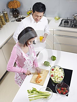 Asian couple in kitchen