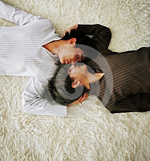 Asian couple lovers on white bed in bedroom holiday. family relationship love together concept.