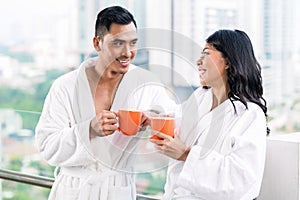 Asian couple in morning front of city skyline