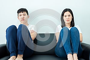 An Asian couple stays together with boring and social distancing