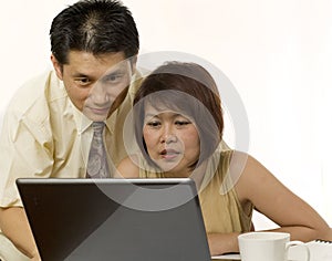 Asian couple surfing the internet