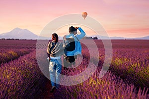 Asian couple travel in lavender field