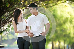 Asian Couple Walking in a park
