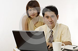 Asian couple working together