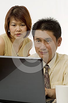 Asian couple working together