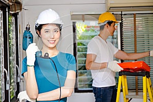 Asian couples wearing helmets help renovate their homes to make them beautiful and livable.