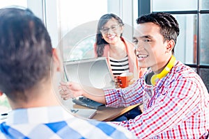 Asian creative start-up people discussing