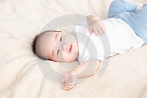 Asian cute adorable baby healthy boy good mood smiling laughing lie down on bedroom upturn playing with camera or mother, baby