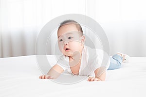 Asian cute adorable baby healthy boy good mood smiling laughing lie down on bedroom upturn playing with camera or mother, baby