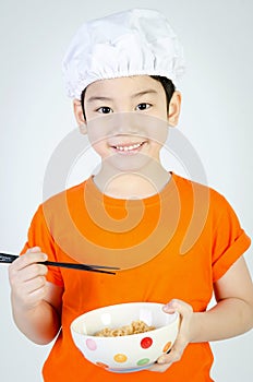 Asian cute child eating ramen noodles