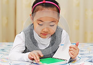 Asian cute girl reading book